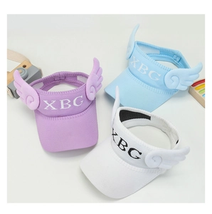 Detail of children's sun visors with 3D wings in purple, blue, and white colors
