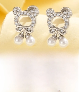 Detail of silver bear earrings with zircon and pearls, titanium steel flat back posts