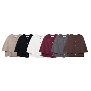 Detailed view of women's knitted cape cardigan in six neutral colors with button front