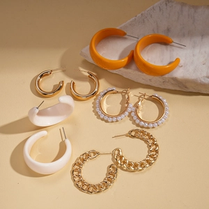 Ten-piece gold and pearl hoop earring set featuring resin acrylic C-shape and chain designs