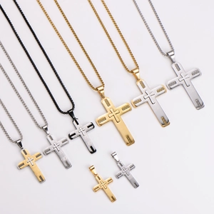Cross necklaces in gold and silver steel with greek key patterns and textured details