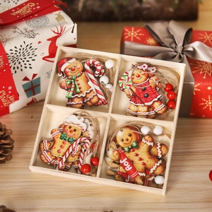 Close-up of 4 wooden gingerbread man ornaments with accessories in a wooden box