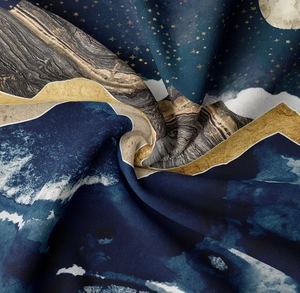 Detailed close-up showing the wavy fabric texture and golden mountain prints on navy tapestry