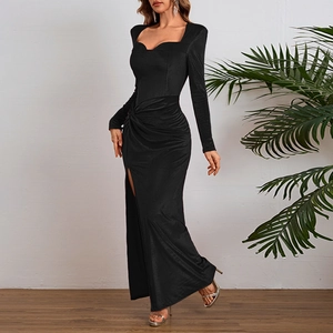 Detailed view of elegant black velvet dress showing side slit and high-quality fabric texture