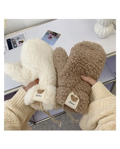 Close-up of thick plush mittens with cute bear labels for winter wind protection