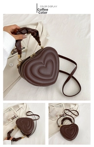 Macro view of brown heart-shaped bag showing layered texture and ruched handle