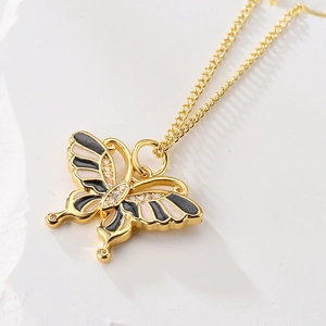Elegant 18K gold plated butterfly pendant necklace with black and cream enamel and zircons