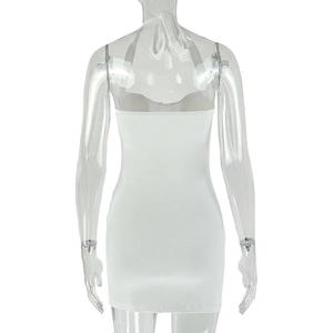 Detail of the backless halter design and sleek fitted hem on this white mini dress