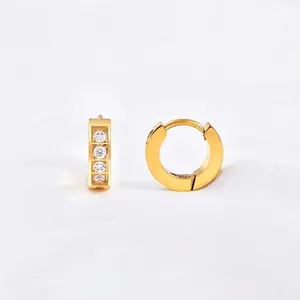 Minimalist gold hoop earrings with channel-set zircons and a secure hinged closure