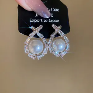 Silver drop earrings with sparkling cubic zirconia pavé and large white round pearls