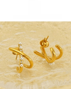 Detail of 18K vacuum plated gold earrings with white pearls and sparkling rhinestones