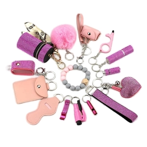 Pink rhinestone personal safety keychain set with alarm and accessories in 15-piece kit