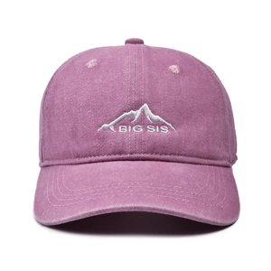Detailed view of washed purple baseball cap featuring mountain and BIG SIS embroidery