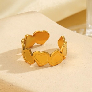 Minimalist 18K gold plated heart cross open ring displayed on a natural stone base