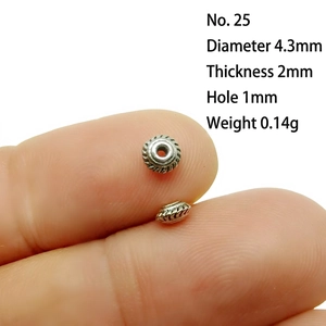 Detail of 4.3mm silver alloy spacer bead for DIY jewelry with gear texture