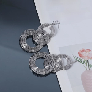 Dramatic silver layered geometric hoop earrings with polished concentric circles