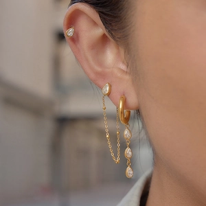 18K gold plated stainless steel teardrop rhinestone tassel earrings worn on model