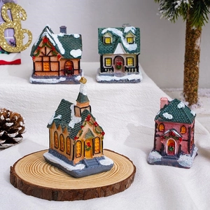 Set of four LED glowing resin Christmas village houses with snowy rooftops for decor