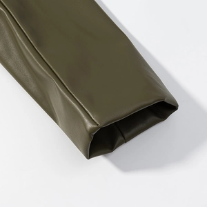 Detailed macro view of army green PU leather sleeve cuffs with precise stitching work
