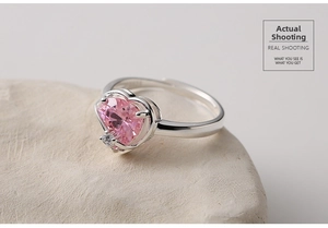 Detail of S925 silver ring featuring a pink heart-shaped gemstone and adjustable open band