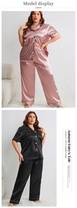 Detail view of oversized satin pajamas featuring contrast piping and silky texture finish