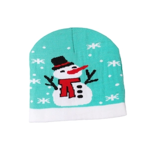 Light turquoise Christmas knit beanie featuring white snowflakes and snowman patterns