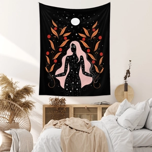 Detail view of Bohemian tapestry with celestial goddess and moon on bedroom wall