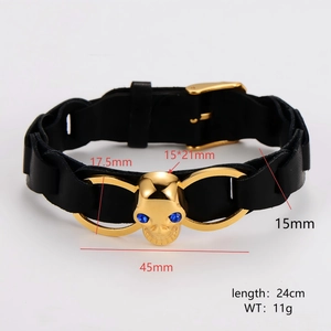 Adjustable black leather bracelet with gold skull charm and blue gem eyes for men