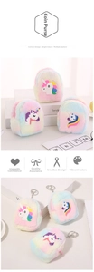 Detail view of plush unicorn coin purse featuring macaron gradient fur and metal keychain