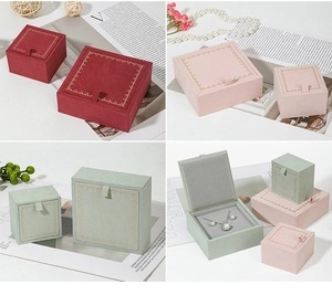 Detailed views of velvet jewelry boxes with vintage gold trim in red and pink tones