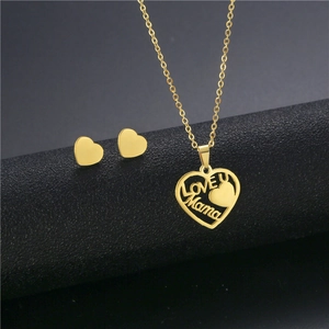 Detailed view of golden heart jewelry set with LOVE U Mama hollow engraving on dark stand