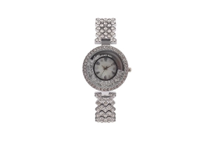 Close-up of a silver-tone women's quartz watch with sparkling rhinestone embellishments