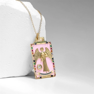 Macro view of gold tarot Temperance pendant with pink enamel and colorful zircon stones