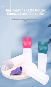 Detail of multi-color hair oil applicator bottles with comb teeth caps on a white platform