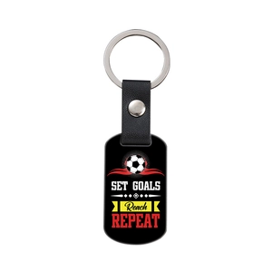 Leather and metal football keychain with motivational text for teams and friends