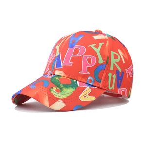 Detail of colorful alphabet print on red baseball cap showing street style graffiti