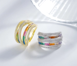 Macro shot of multi-layer crisscross rainbow ring with pavé-set stones and colorful gems