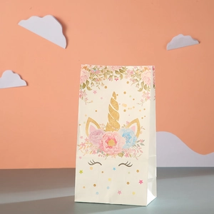 Close-up of unicorn and floral pattern on beige kraft paper gift bag for party favors