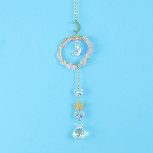 Detailed suncatcher with moon and star accents, gold chains, and pink crystal stones