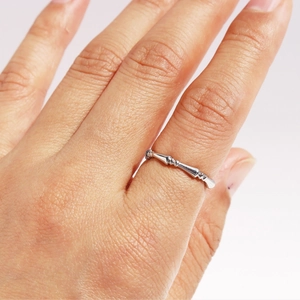 Classic silver bamboo joint ring in minimalist style worn on index finger
