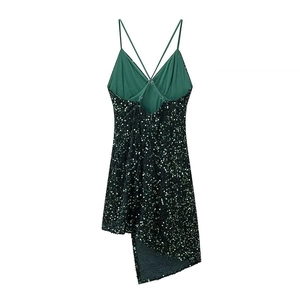 Back view of dark green sequin strap dress with backless criss-cross design and irregular hem