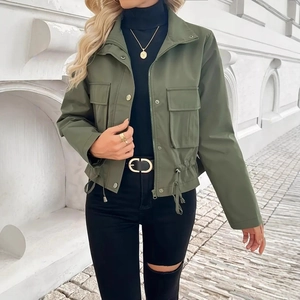 Detail of army green utility jacket featuring drawstring waist and functional pockets
