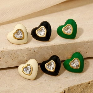 Minimalist heart earrings set in gold with white, black and green enamel and zircons