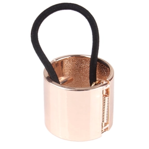 Minimalist rose gold metal ponytail cuff with black elastic band on white background