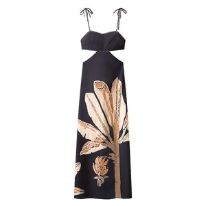 Elegant black backless maxi dress with vibrant tropical floral print and waist cut-outs