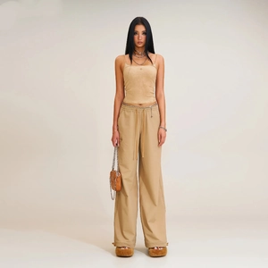 Front view of a khaki wide-leg sport trousers set with adjustable drawstring details