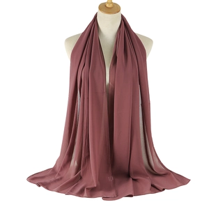 Detail of the high-quality stitching on a mauve pearl chiffon long hijab scarf