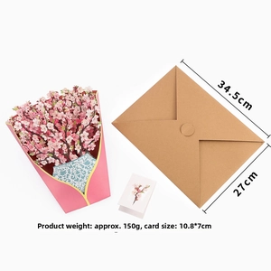Macro detail of a 3D pop-up cherry blossom bouquet card with envelope and mini gift tag