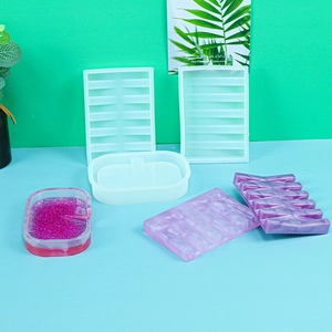 Detailed set of silicone soap dish molds with resin samples and textured finishes