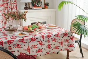 Macro detail of Santa Claus print on festive red and beige linen table runner cloth